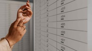 Hands wearing jewellery in a safe deposit centre